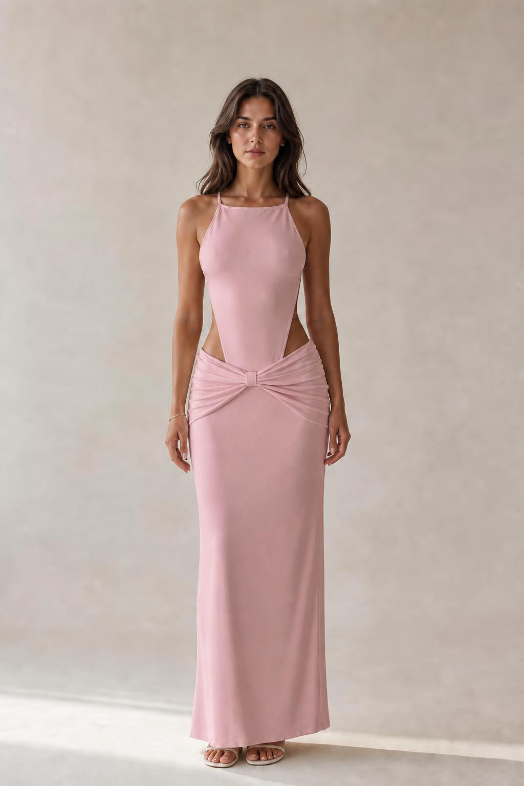 Model wearing pink cut-out ruched maxi dress