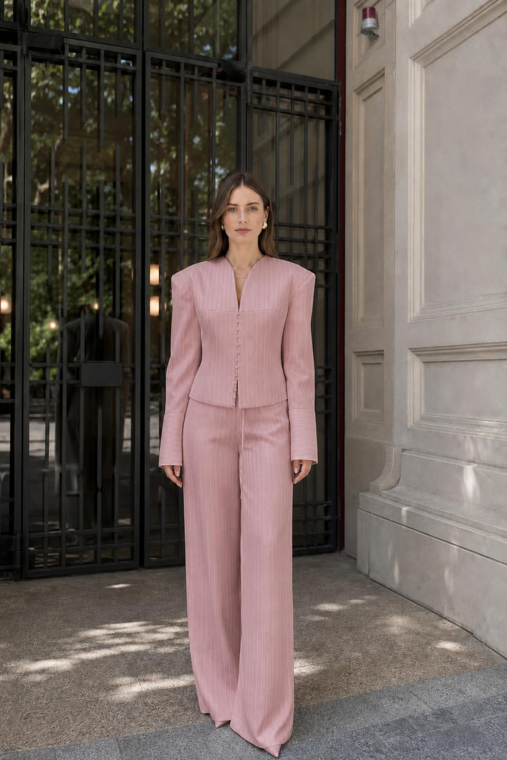 Model wearing pink pinstripe suit