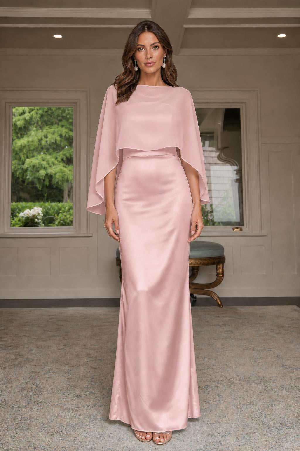 Model wearing pink cape-overlay evening gown