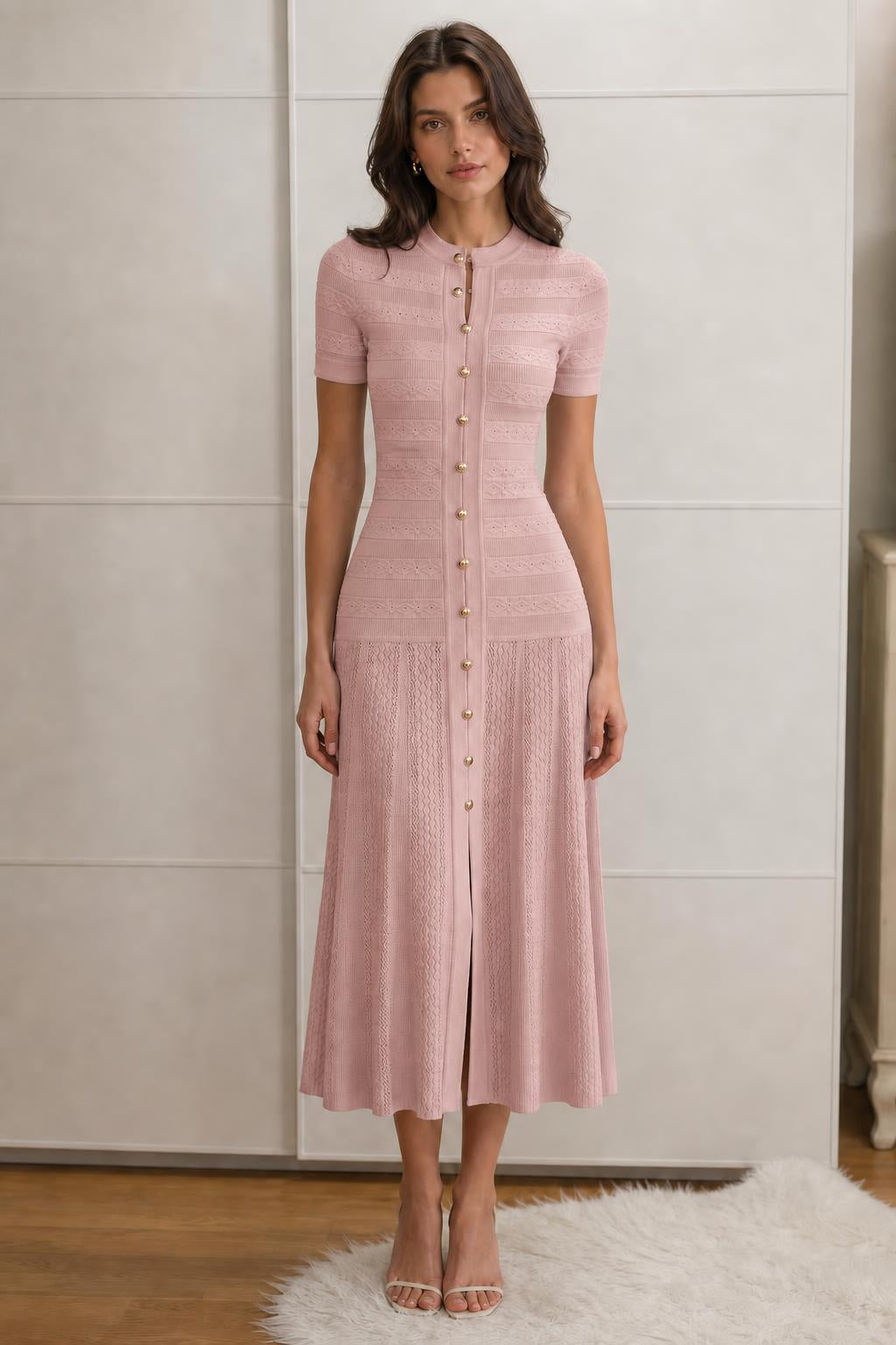 Front view of pink knit midi dress on model