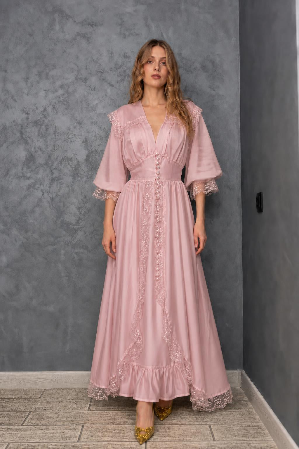 Model wearing pink vintage lace maxi dress