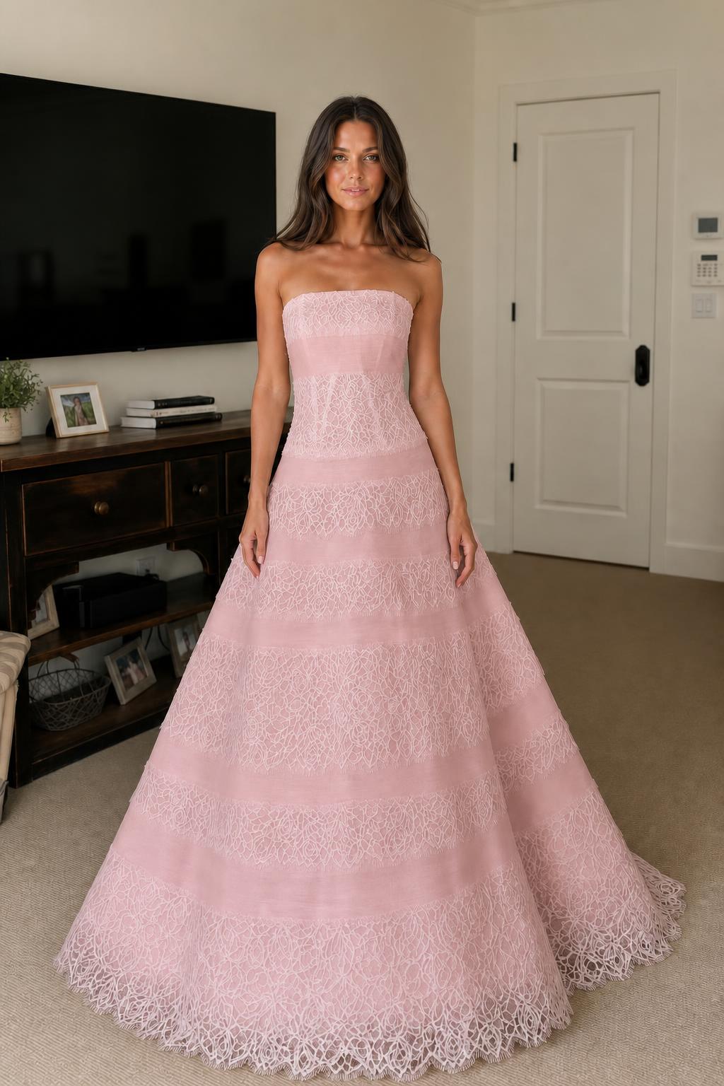 Front view of pink strapless tiered lace evening dress