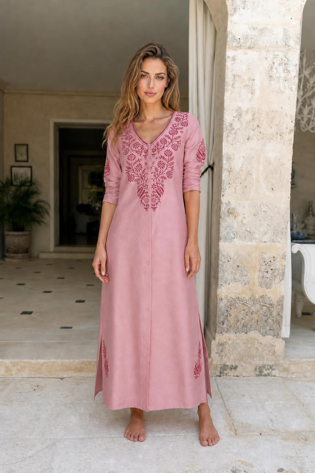 Model wearing pink embroidered maxi dress