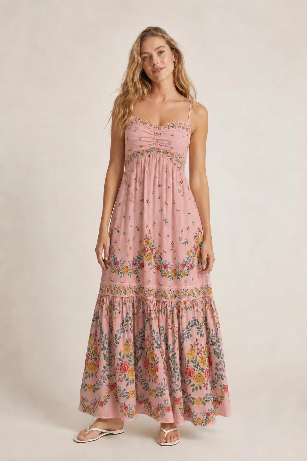 Front view of pink floral maxi dress on model