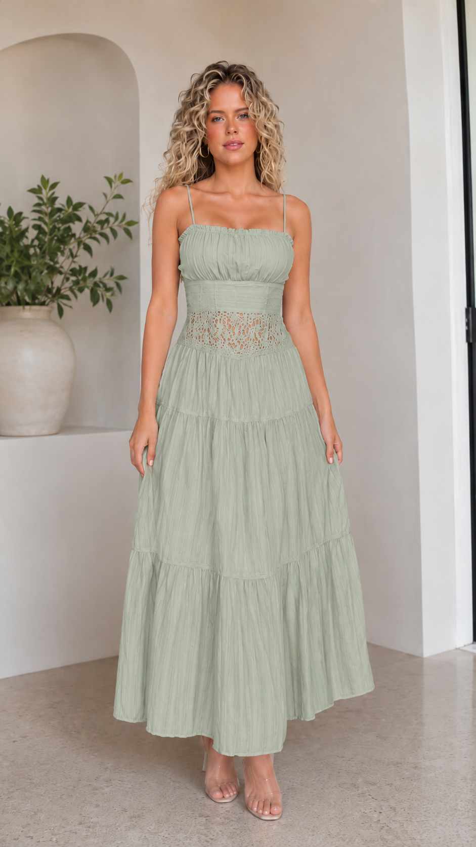 Front view of sage green tiered maxi dress with lace-look waist inset