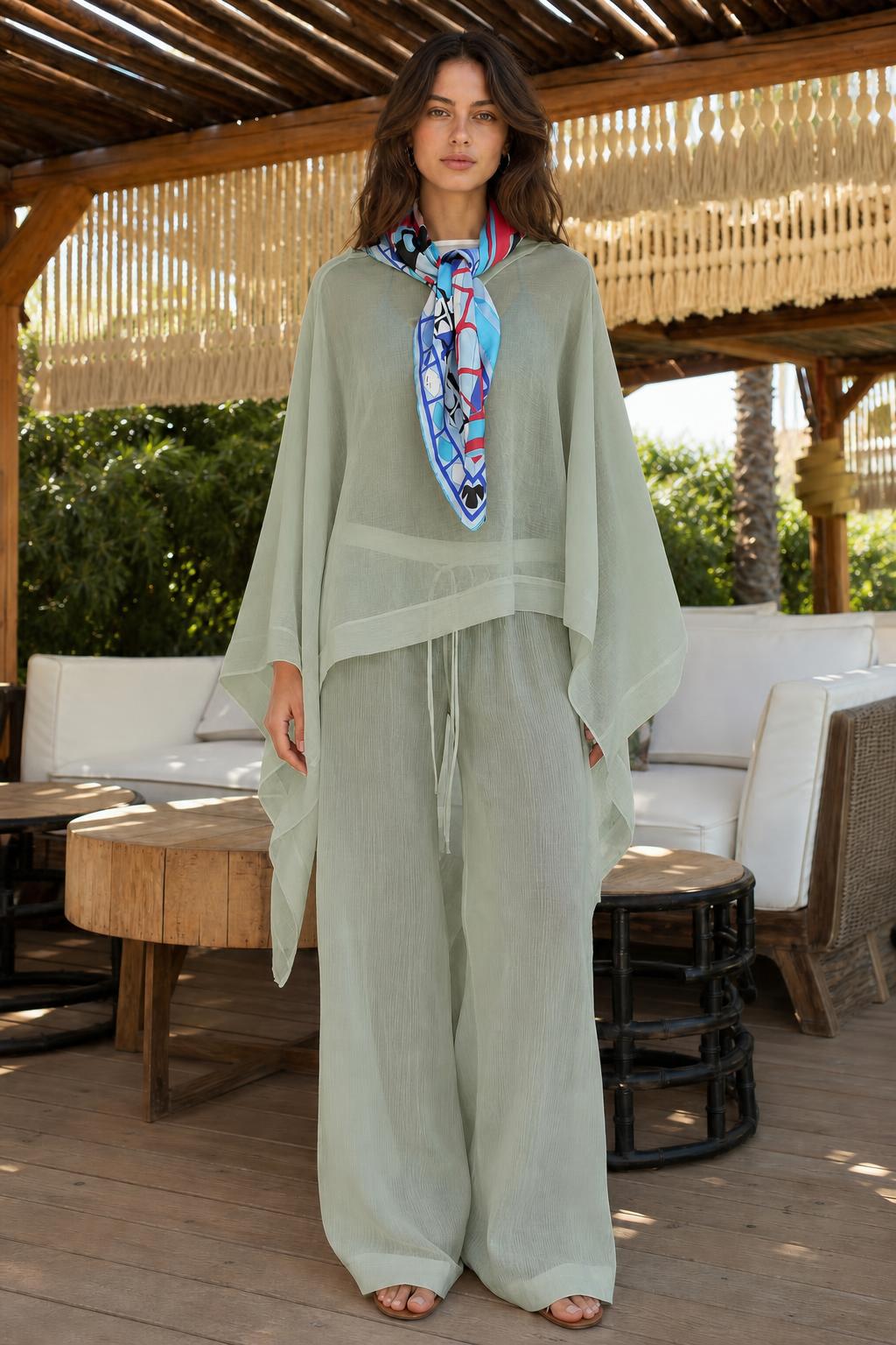 Model wearing sage green two-piece kaftan and wide-leg pants set