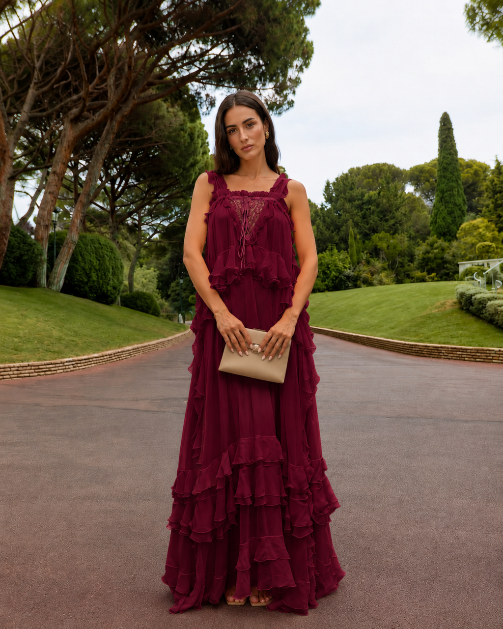 Front view of wine red tiered maxi dress with ruffle trim and lace-look inset