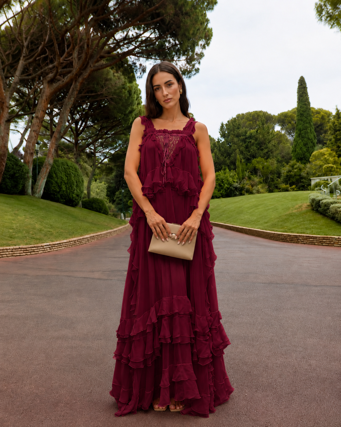 Front view of wine red tiered maxi dress with ruffle trim and lace-look inset