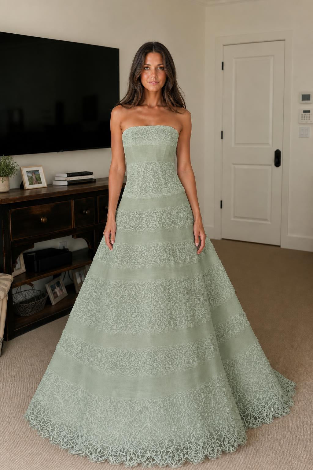 Front view of sage green strapless tiered lace evening dress