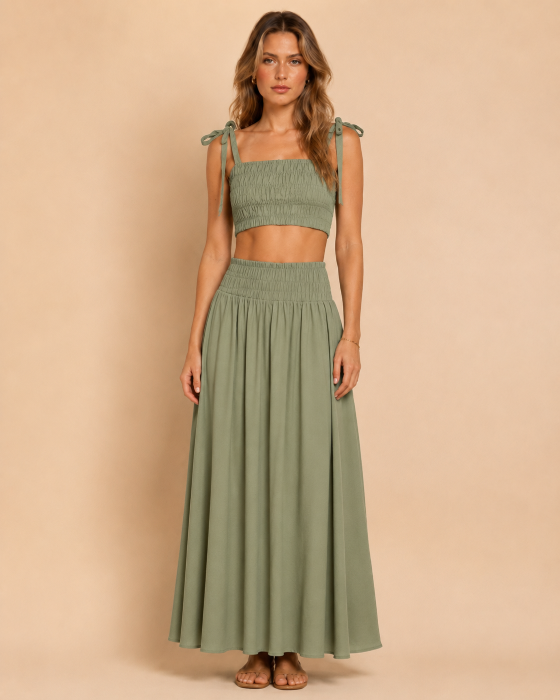 Front view of sage smocked tie-shoulder crop top and matching maxi skirt set