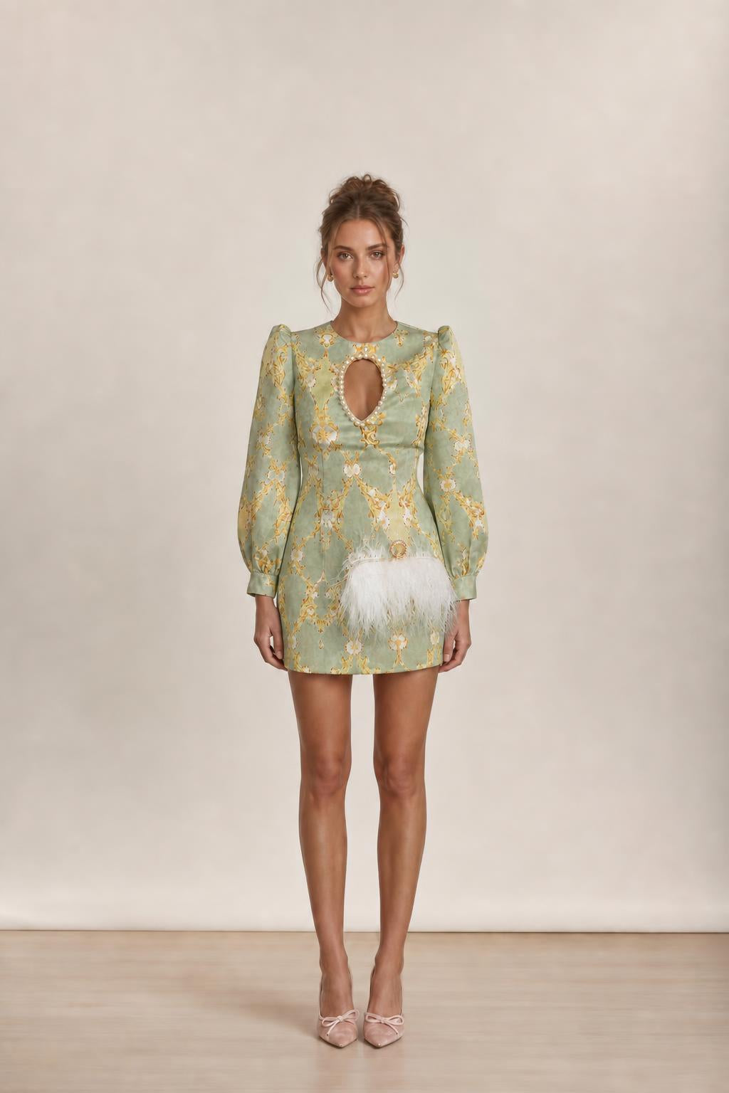 Model wearing sage green baroque print mini dress