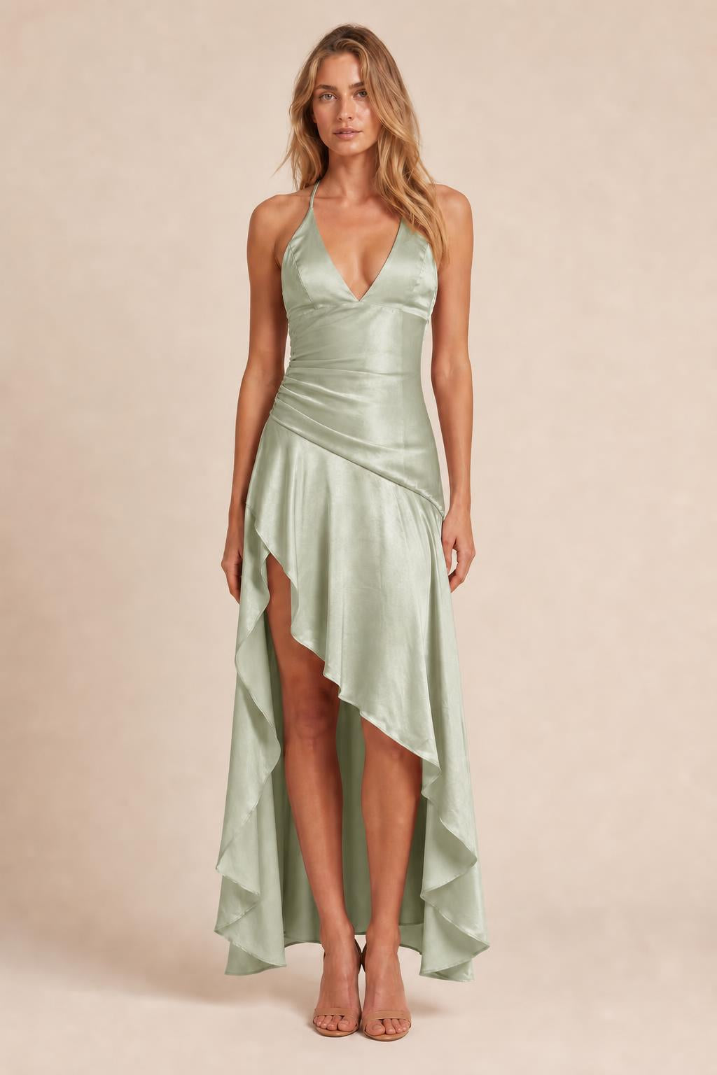 Model wearing sage green satin halter high-low maxi dress