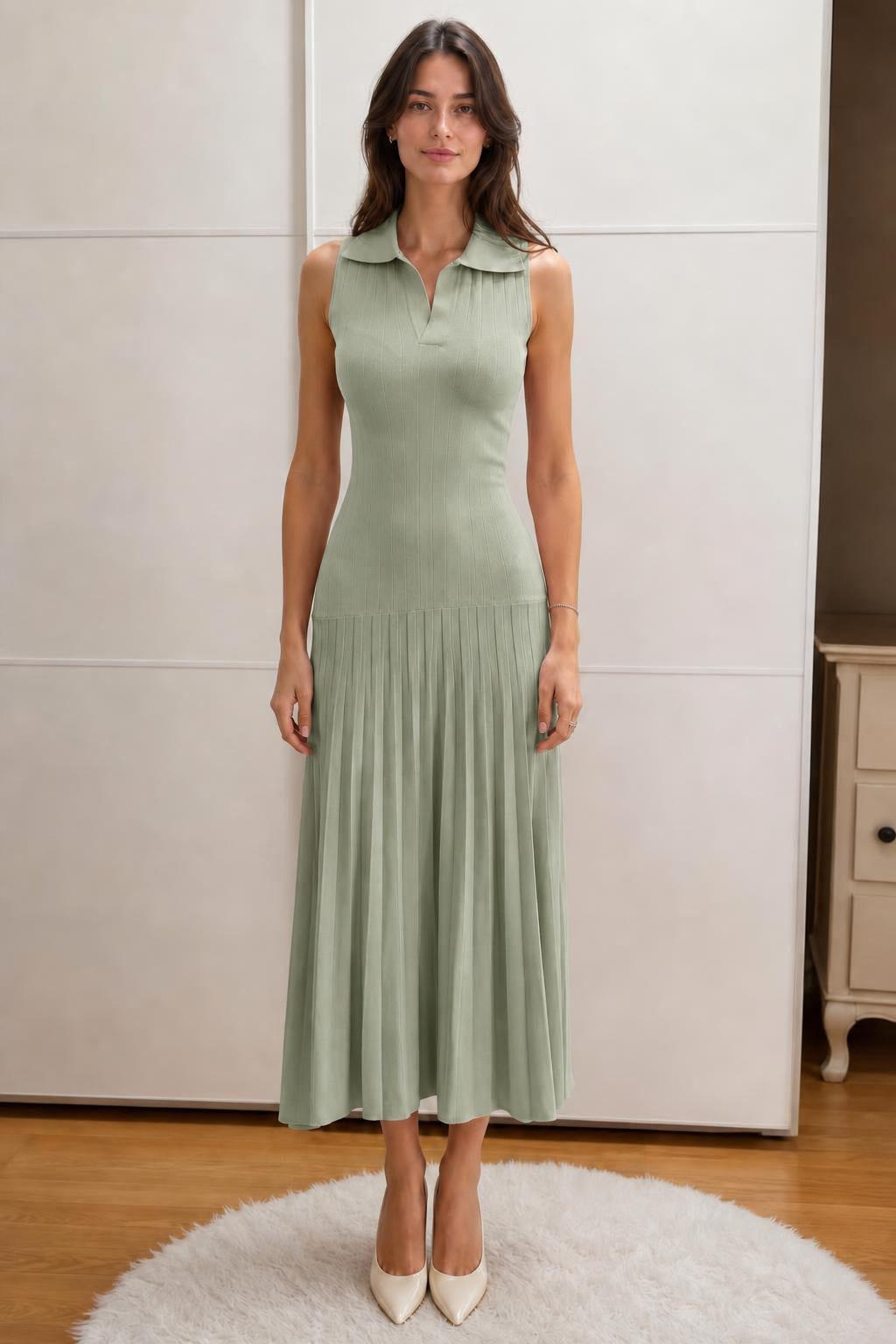 Front view of woman wearing sage green sleeveless polo knit midi dress