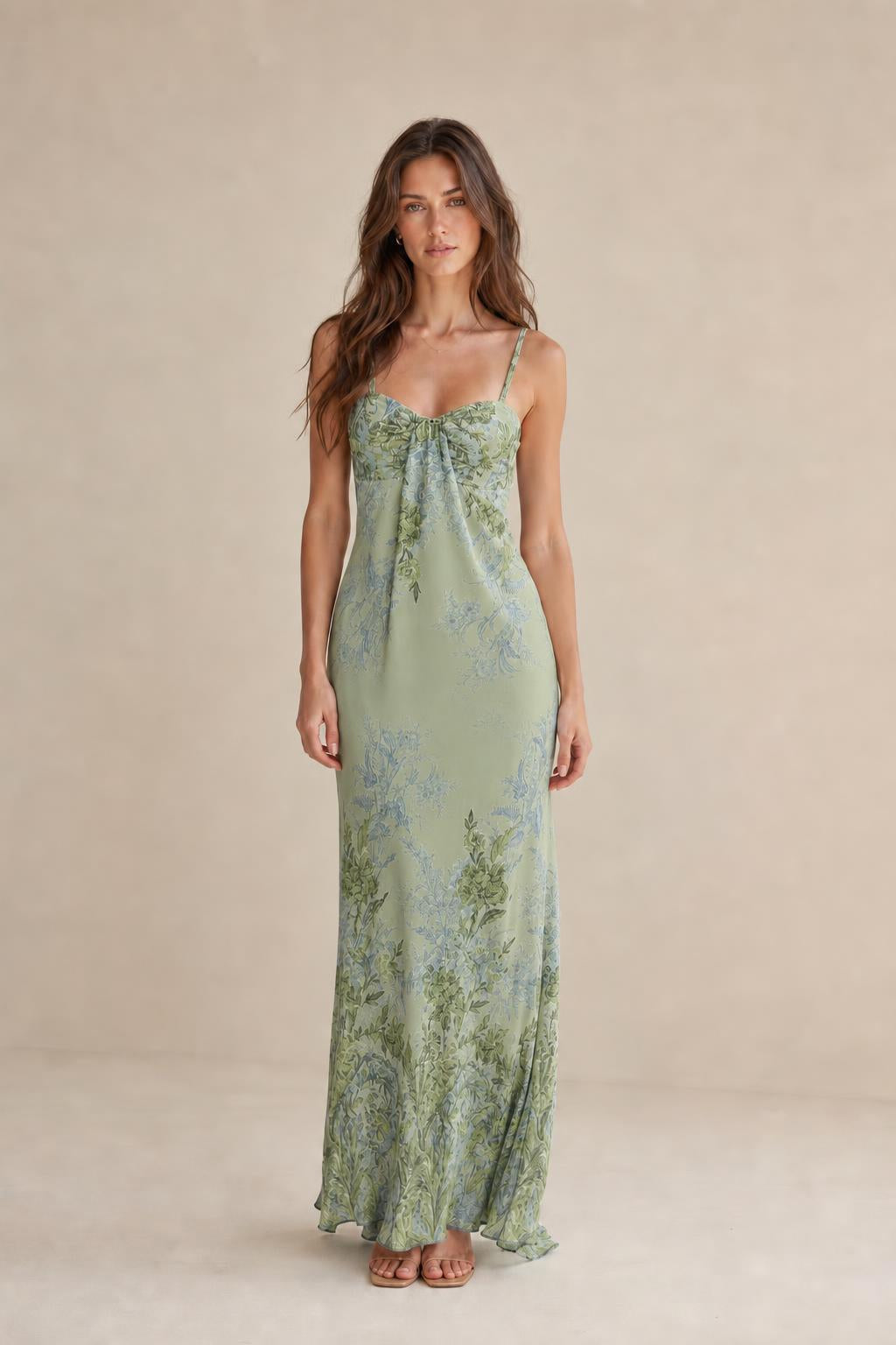 Model wearing sage green floral maxi dress