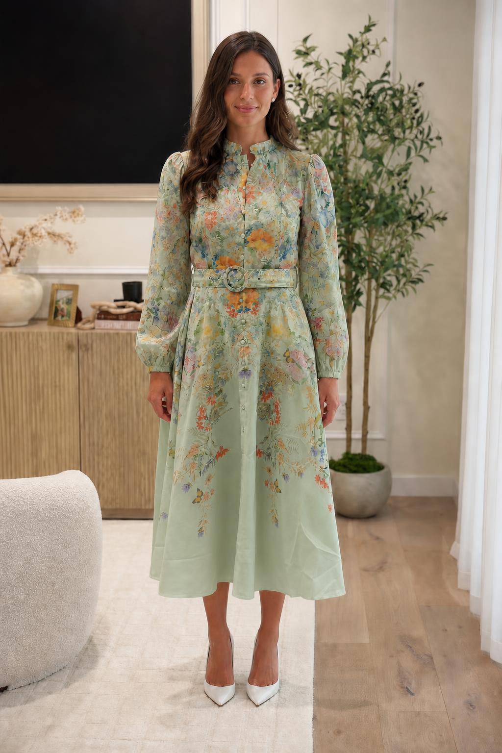 Front view of woman in sage green floral midi dress