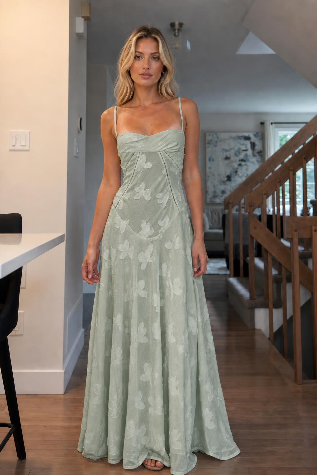 Front view of woman wearing sage green floral jacquard maxi dress