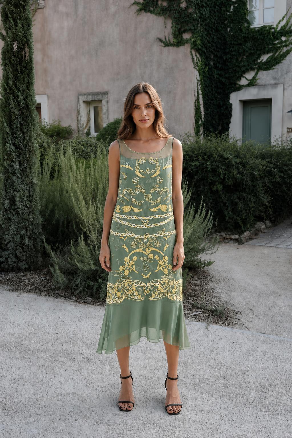Model wearing sage green vintage gold print midi dress