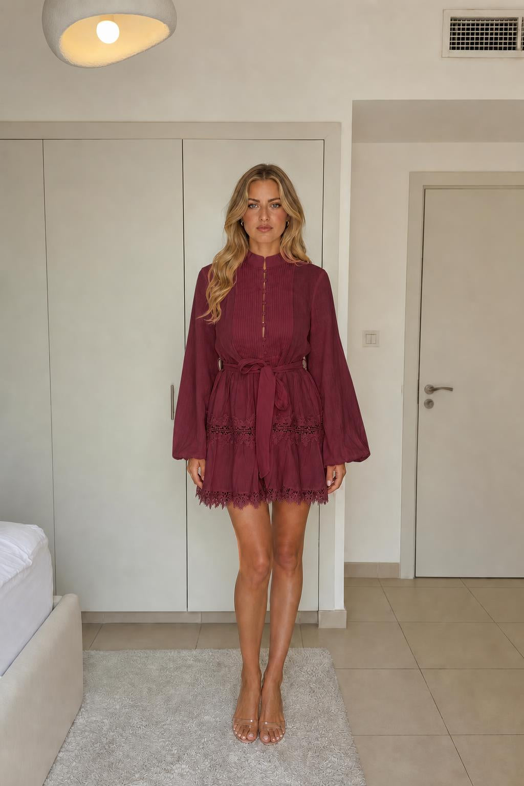 Model wearing burgundy long sleeve mini dress