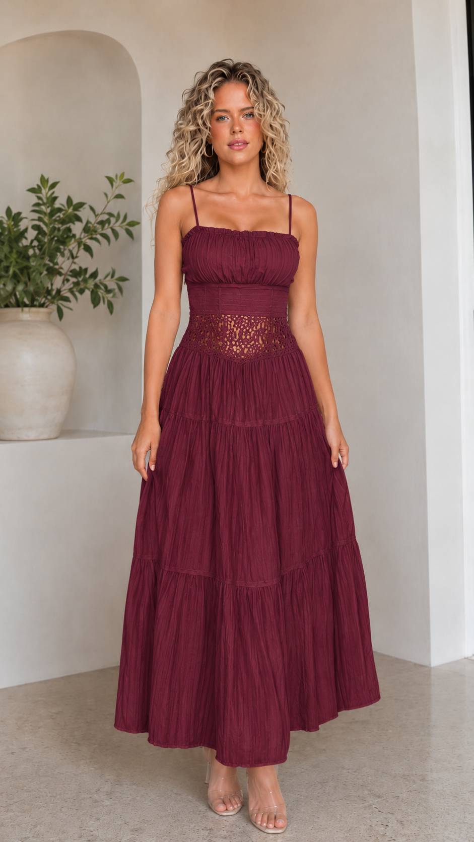 Front view of burgundy pleated maxi dress with spaghetti straps