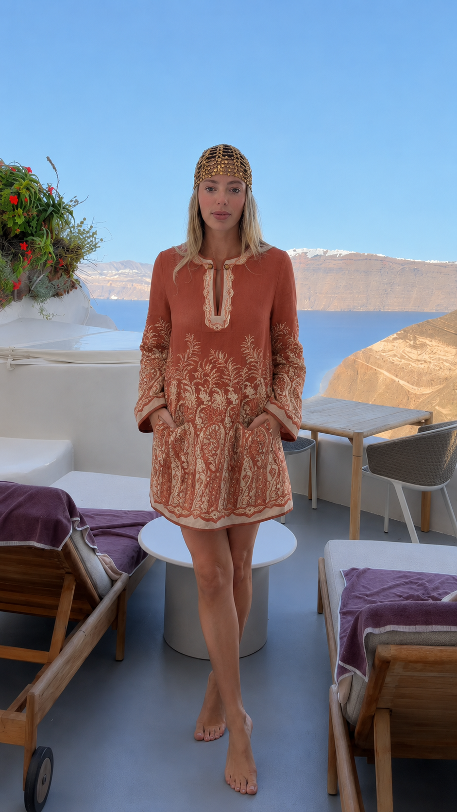 Front view of terracotta embroidered long sleeve tunic mini dress with pockets