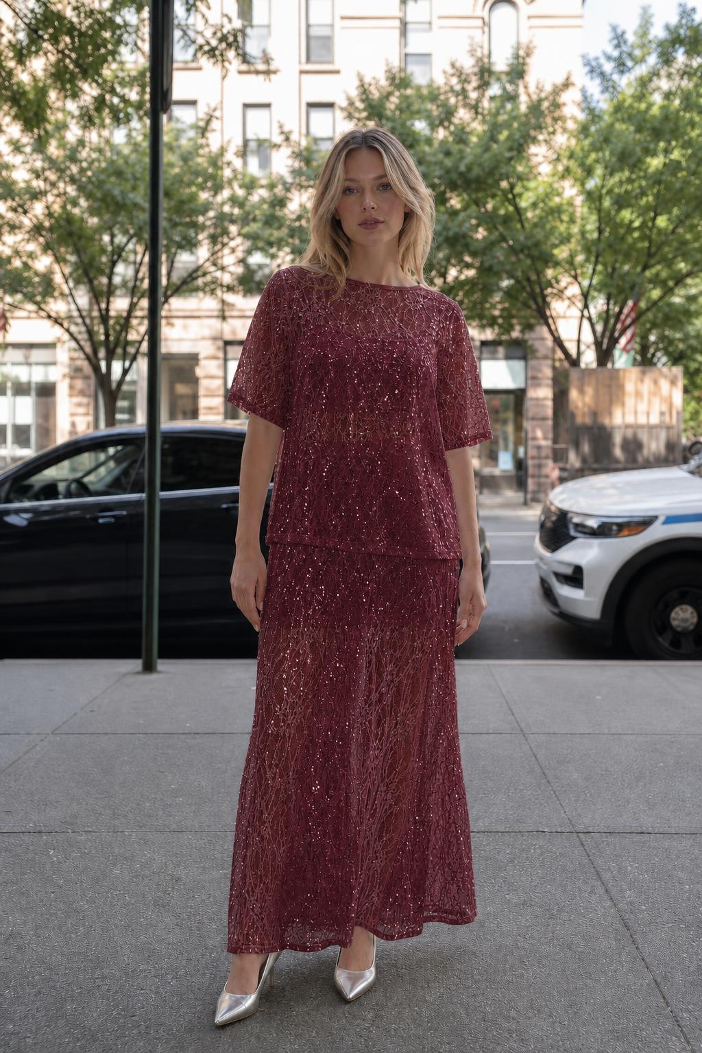 Woman wearing burgundy sheer sequin lace two-piece set