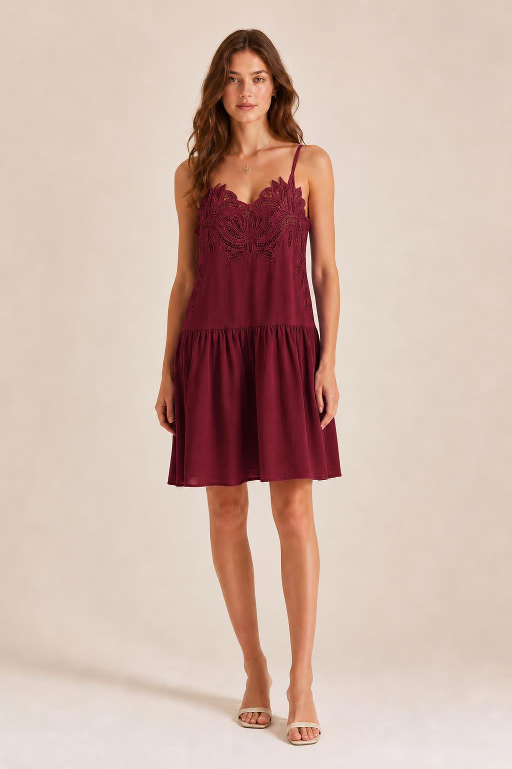 Front view of model in Burgundy embroidered cami mini dress