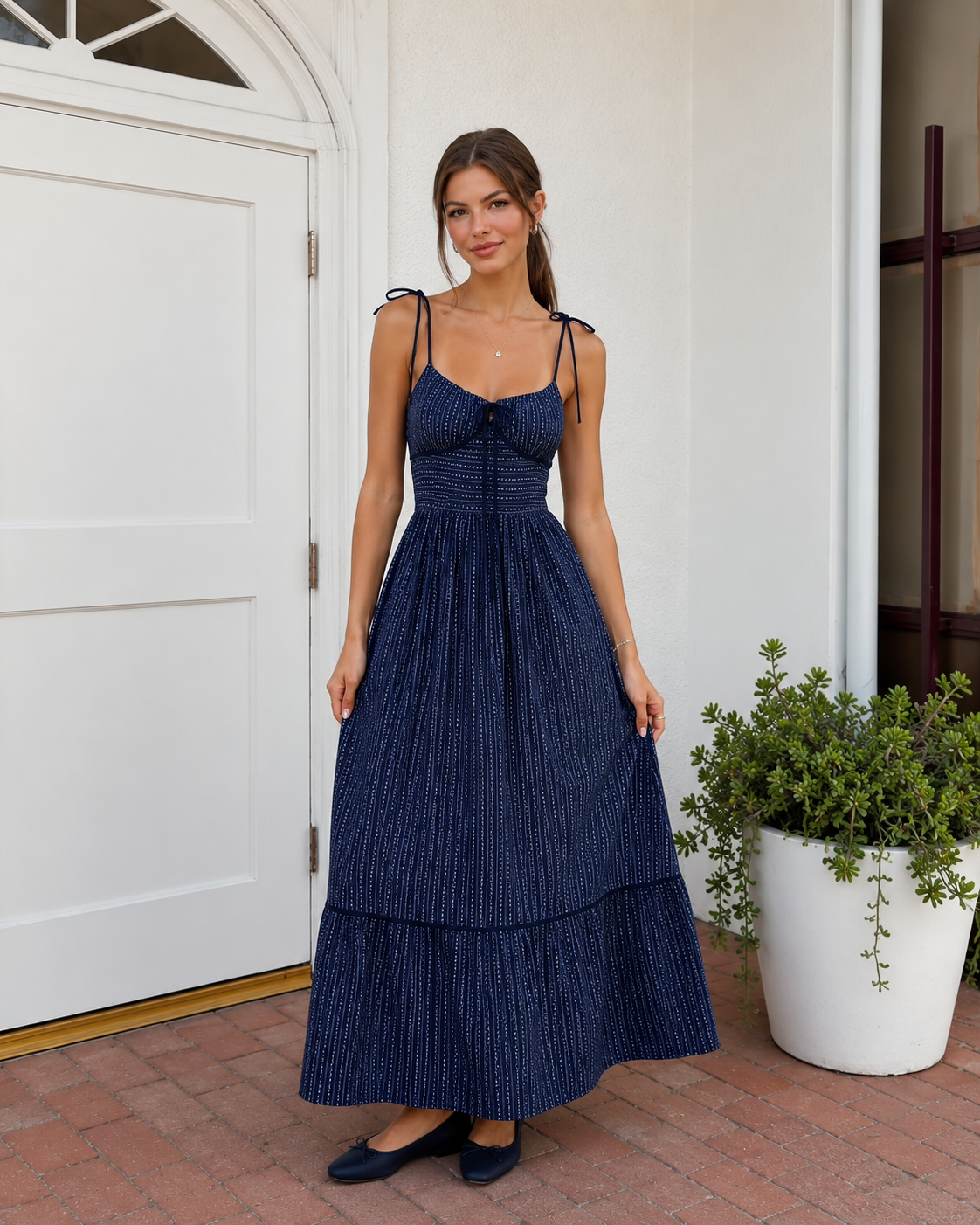 Navy striped tie-shoulder maxi dress with fitted bodice and tiered maxi skirt front view