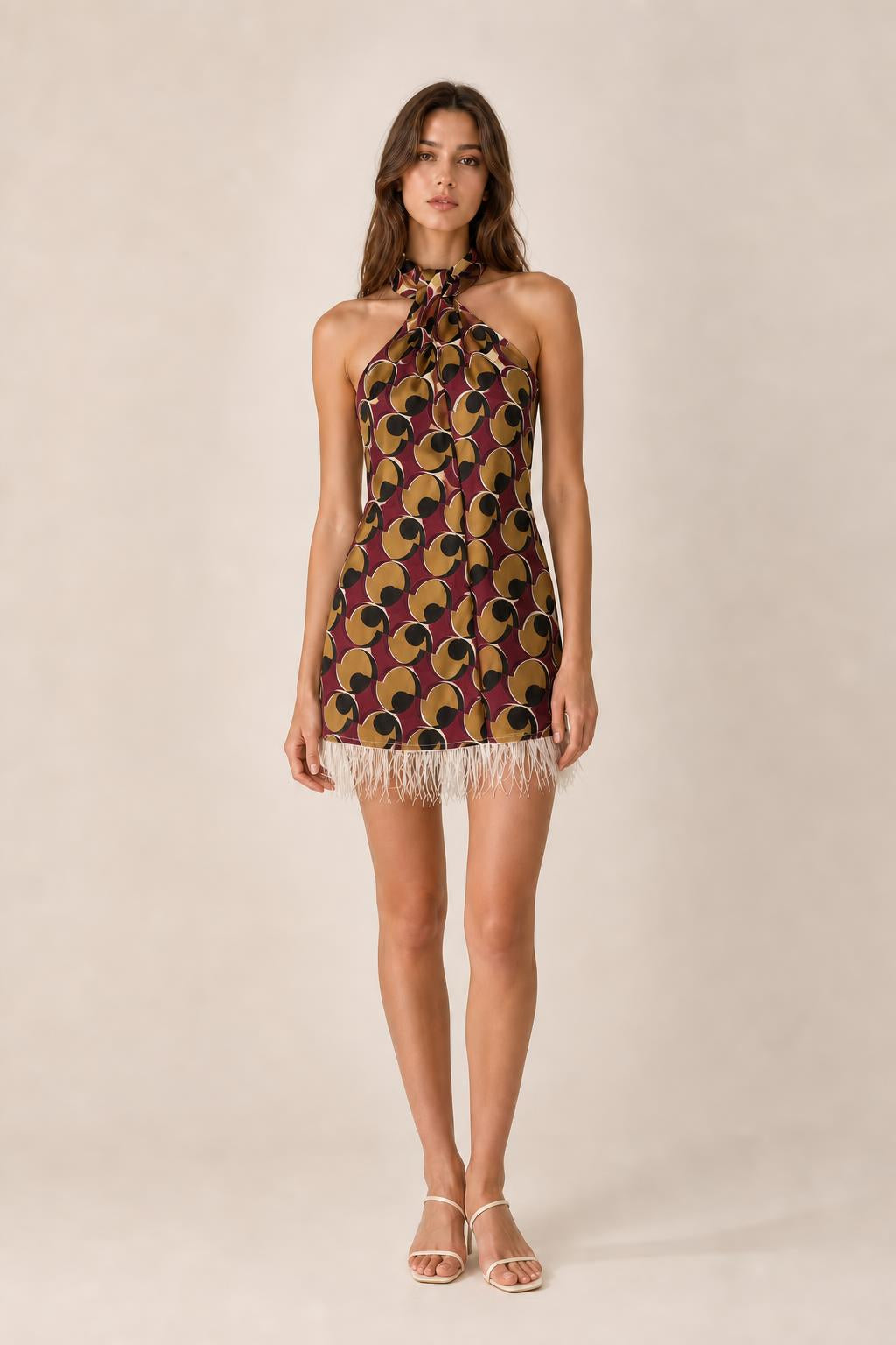 Front view of burgundy color variant geometric halter mini dress