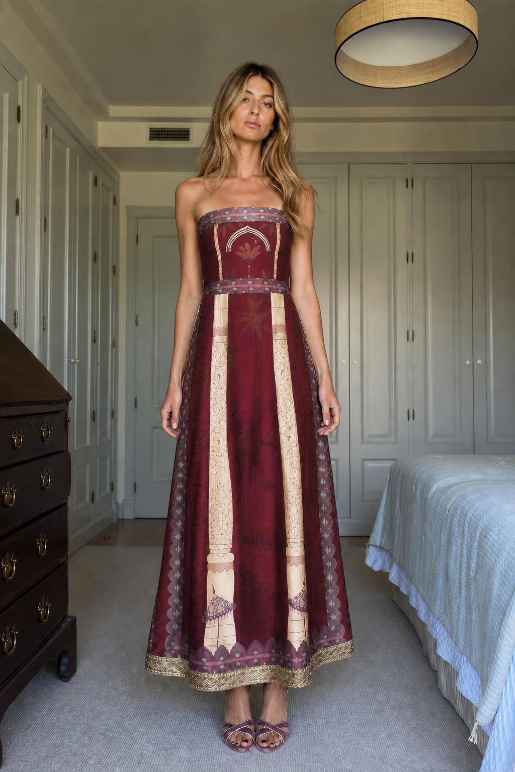 Model wearing Burgundy strapless maxi dress