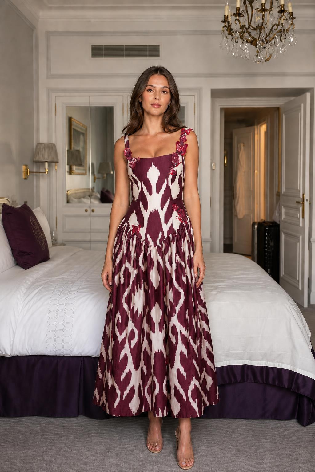 Model wearing burgundy ikat print midi dress