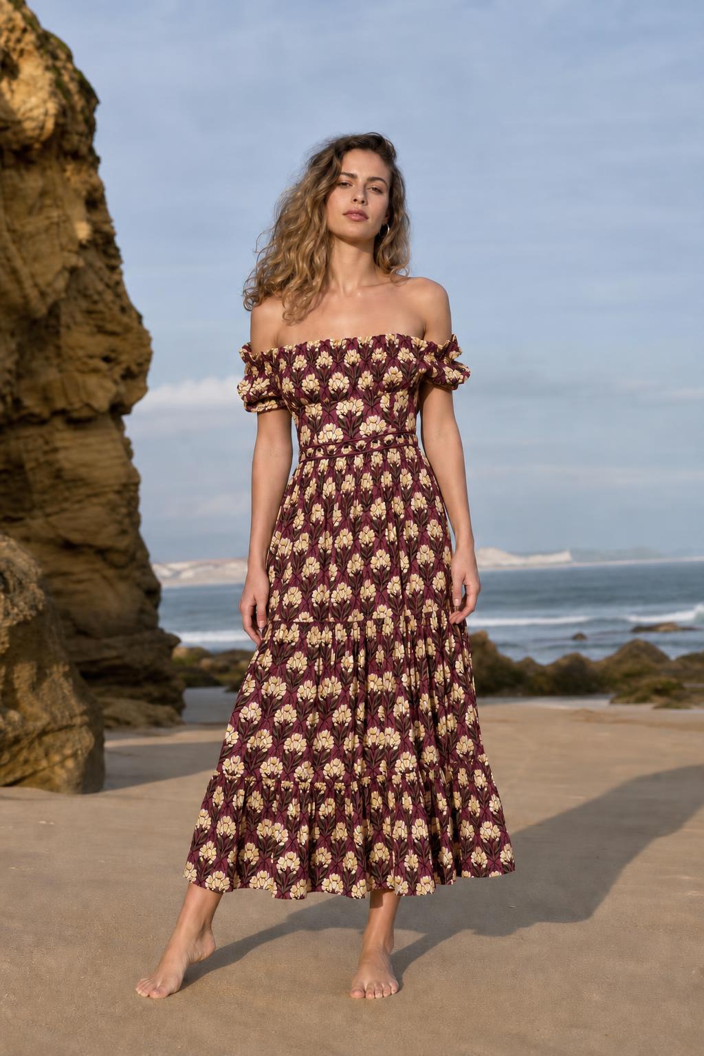 Woman wearing burgundy floral off-the-shoulder midi dress