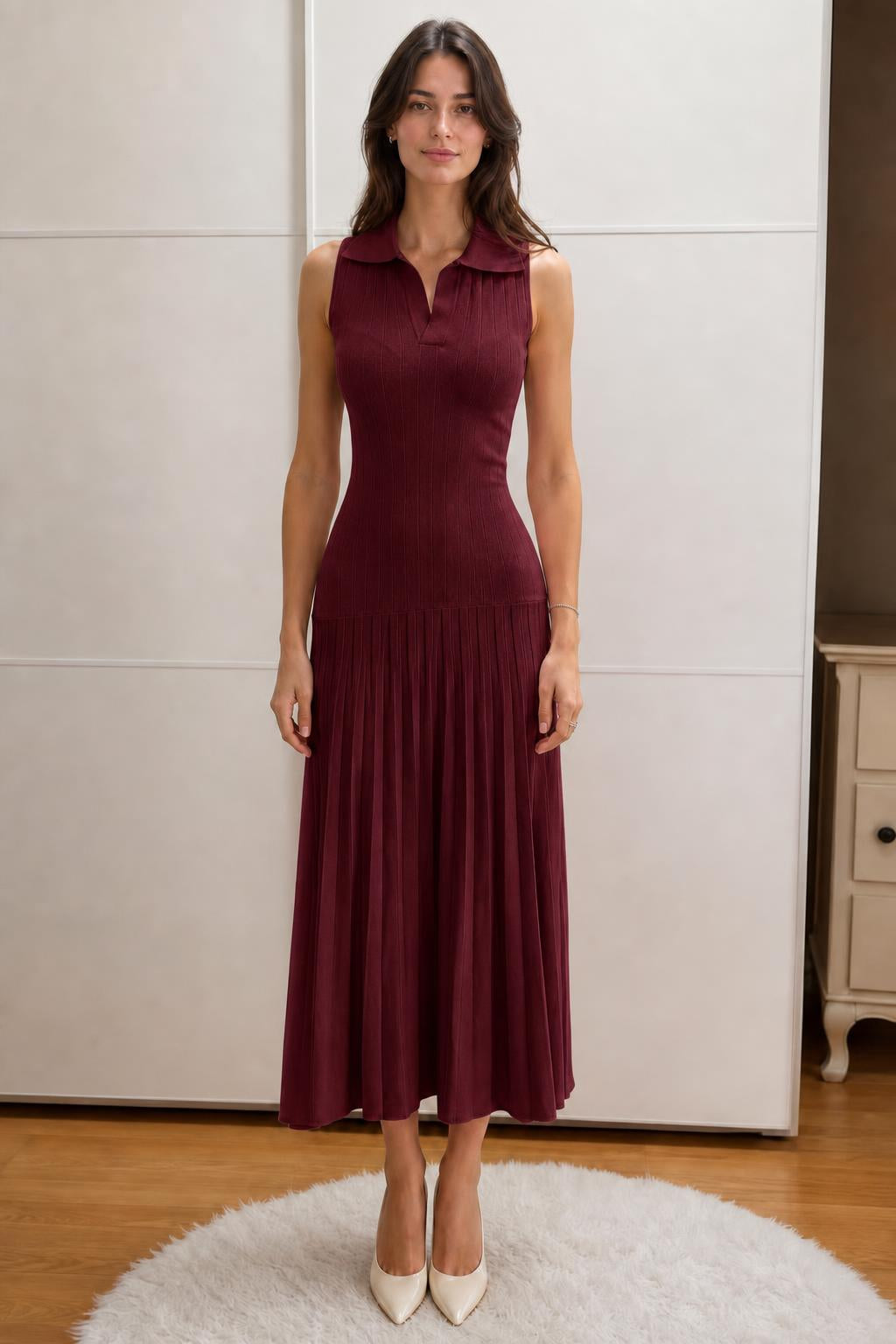 Front view of woman wearing burgundy sleeveless polo knit midi dress