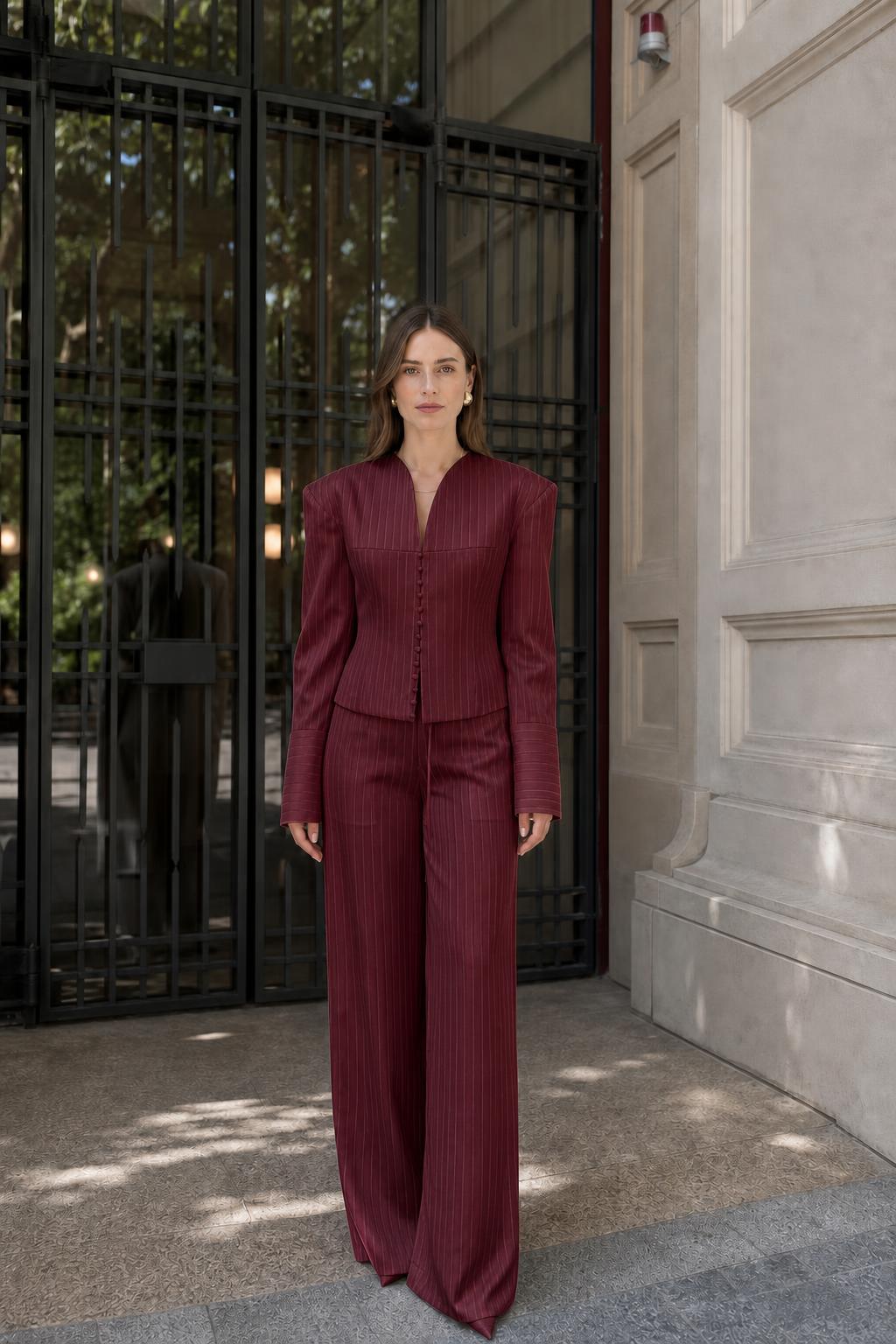 Model wearing burgundy pinstripe suit