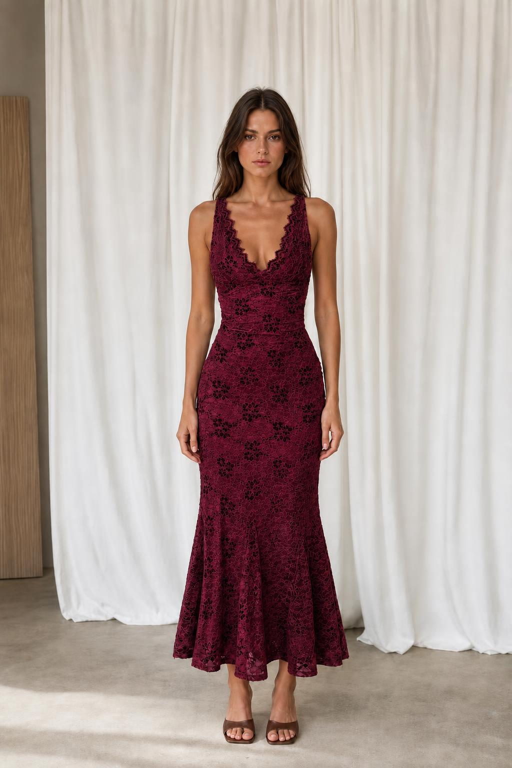 Front view of model in burgundy floral lace dress
