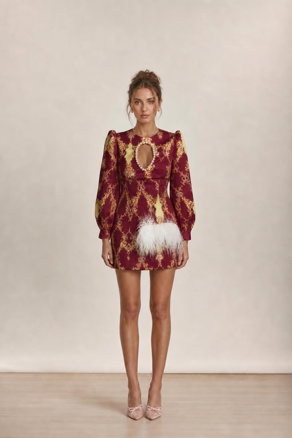Model wearing burgundy baroque print mini dress