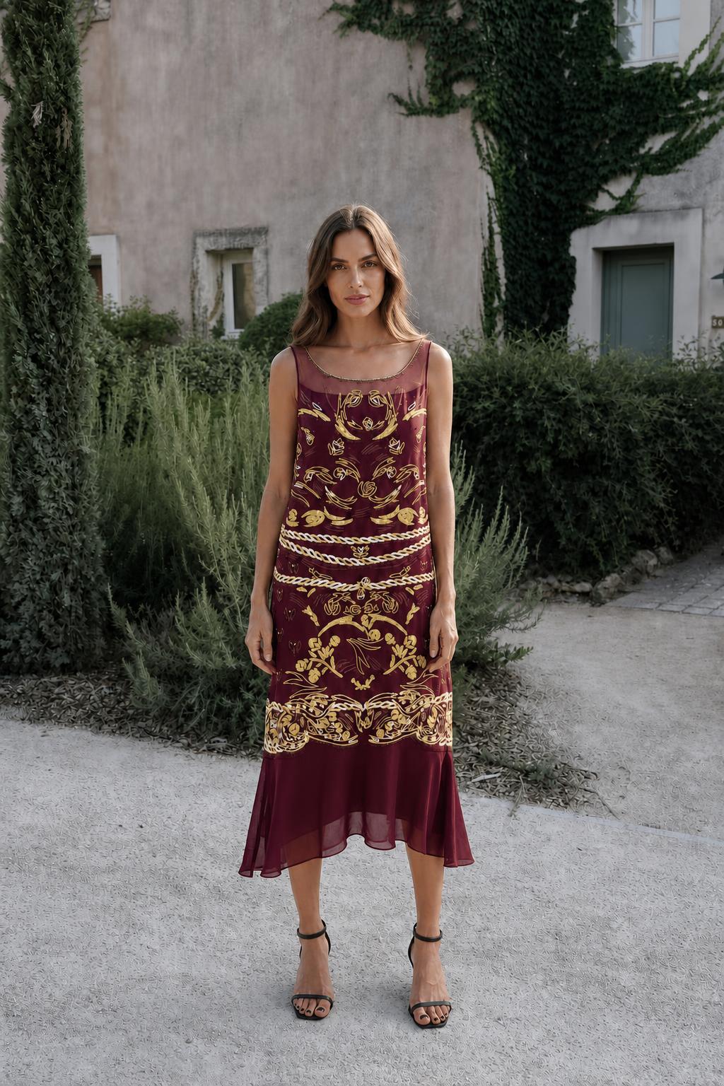 Model wearing burgundy vintage gold print midi dress