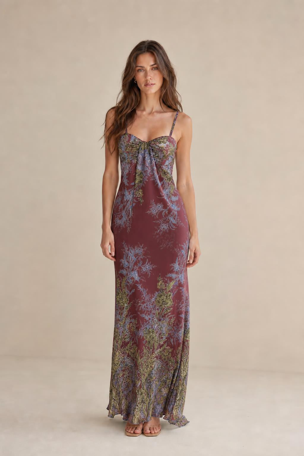 Model wearing burgundy floral maxi dress