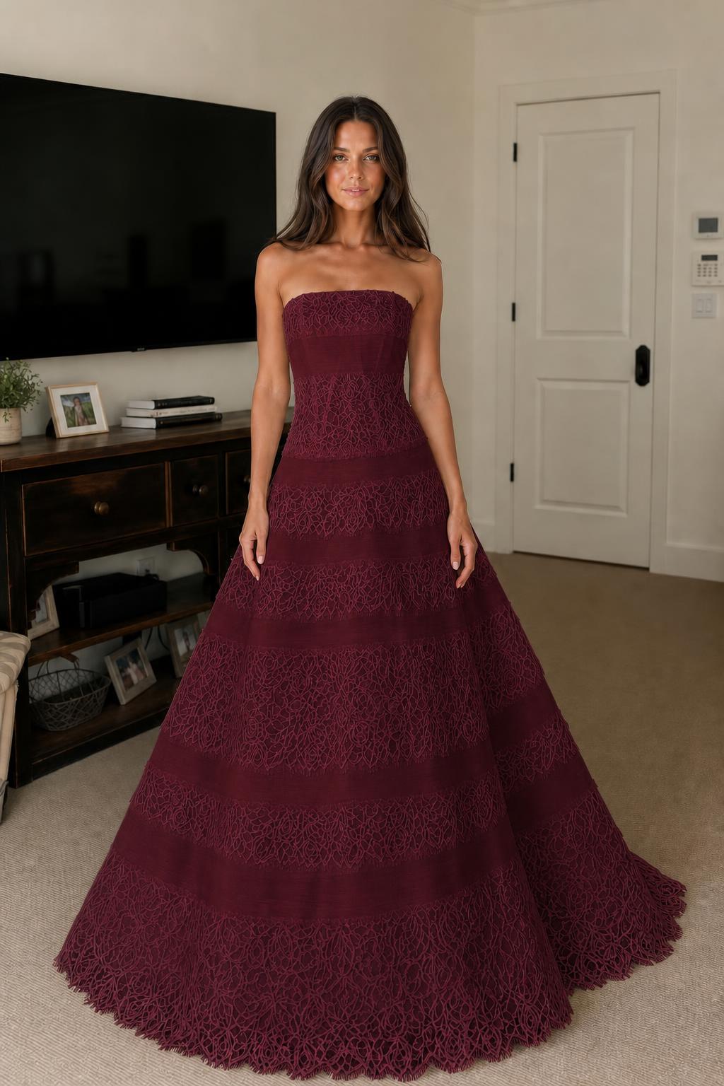 Front view of burgundy strapless tiered lace evening dress