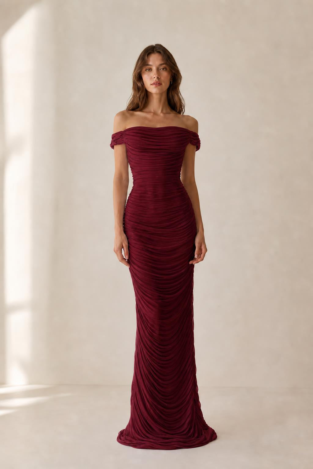 Front view of burgundy off-the-shoulder ruched evening dress