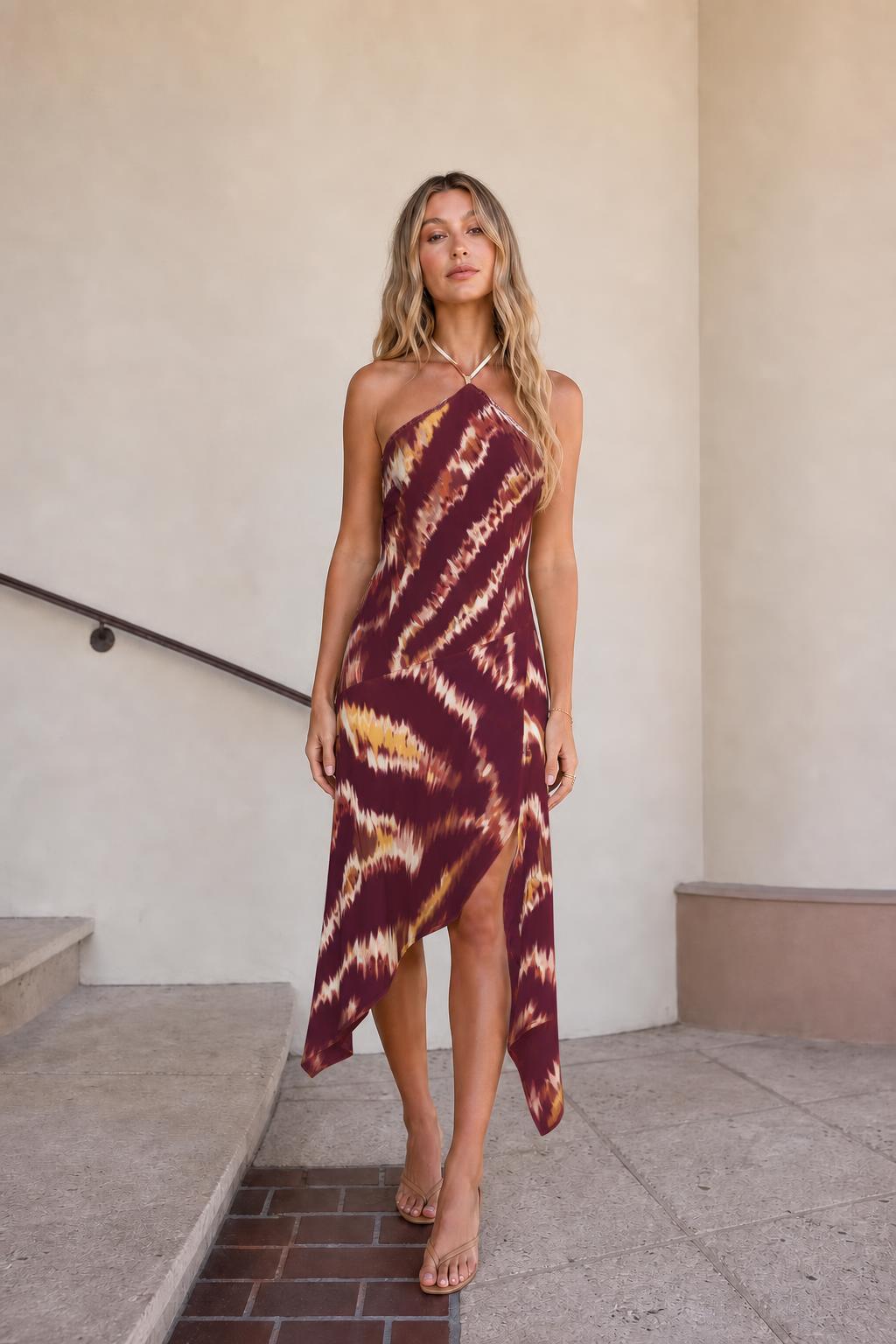 Front view of burgundy printed halter midi dress