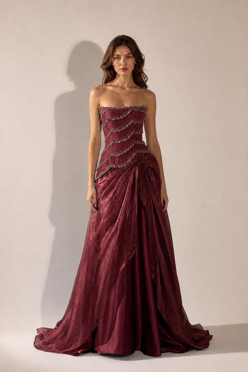 Front view of Burgundy strapless beaded evening gown