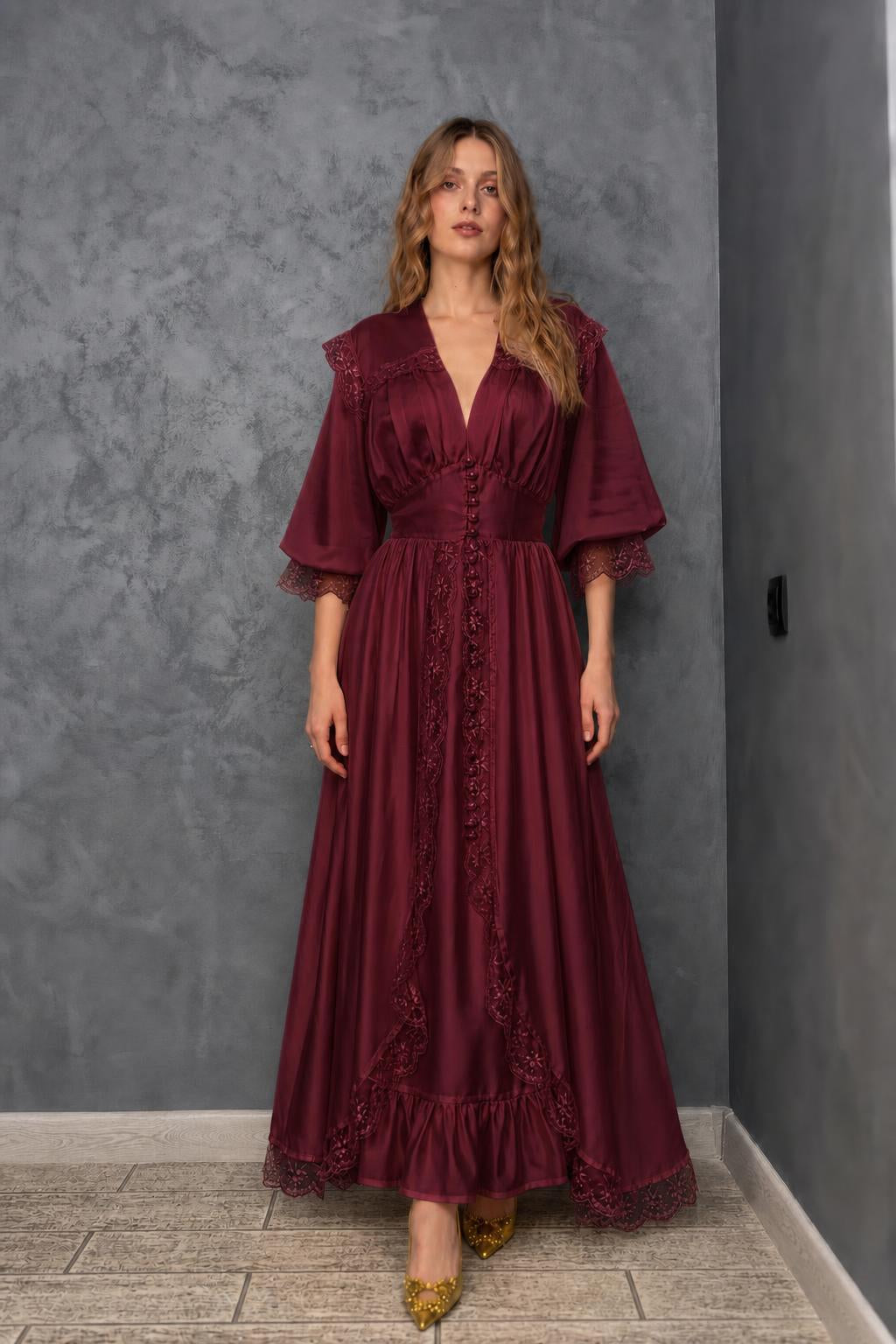 Model wearing burgundy vintage lace maxi dress