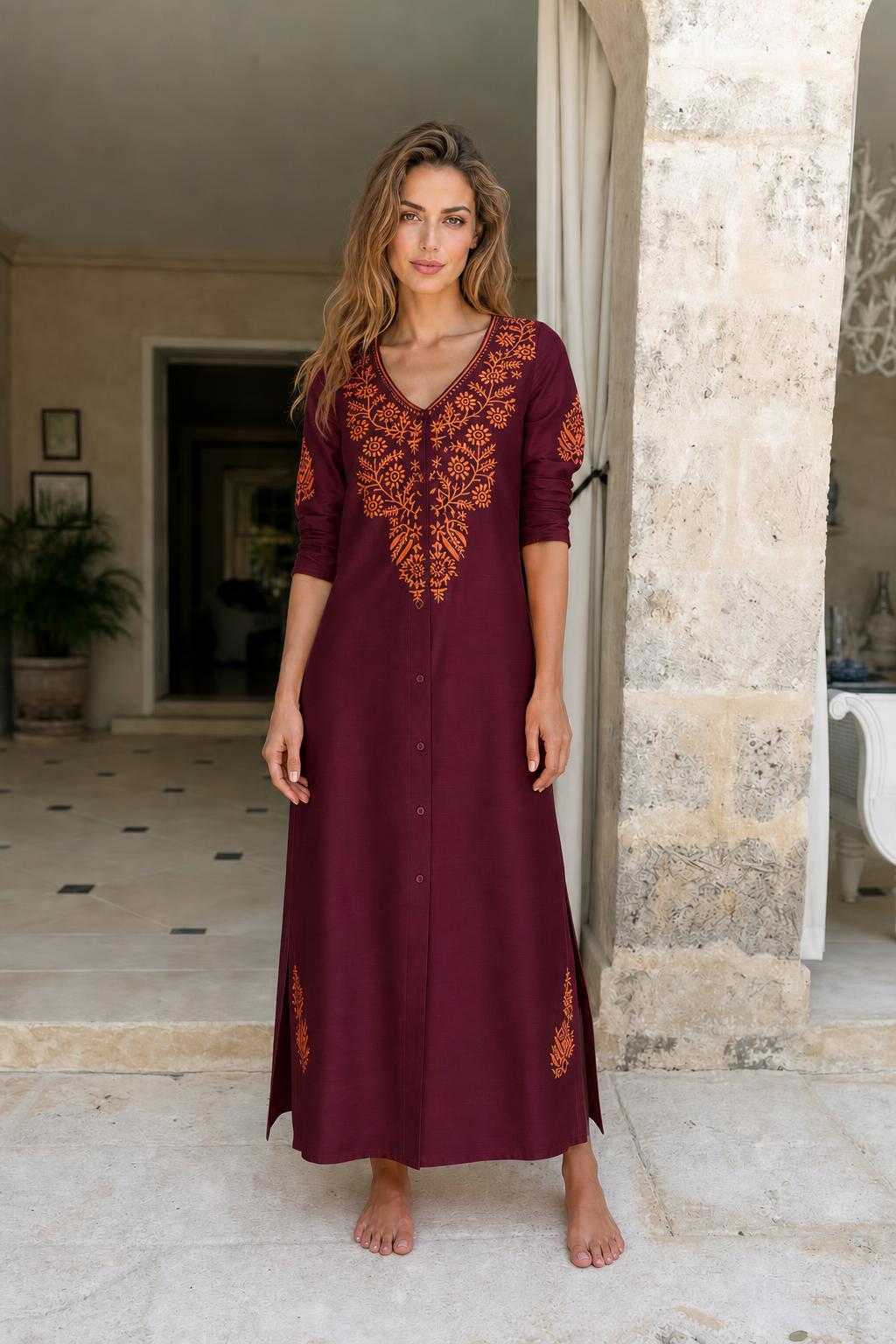 Model wearing burgundy embroidered maxi dress