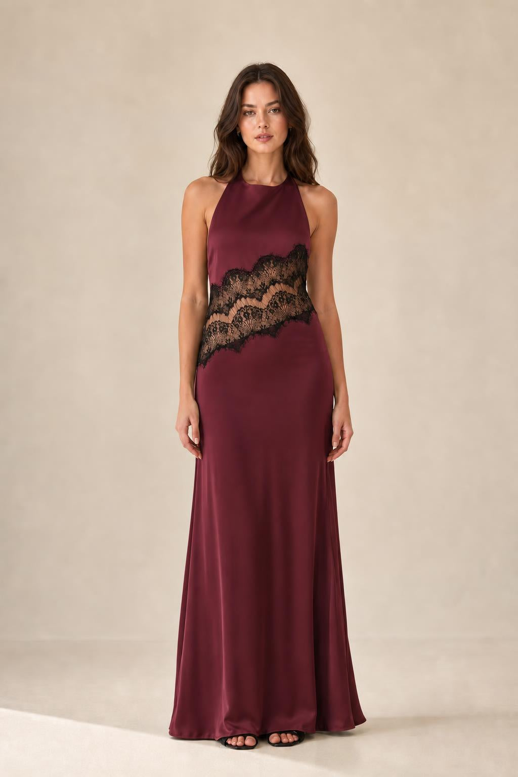 Front view of burgundy halter neck maxi dress with lace insert