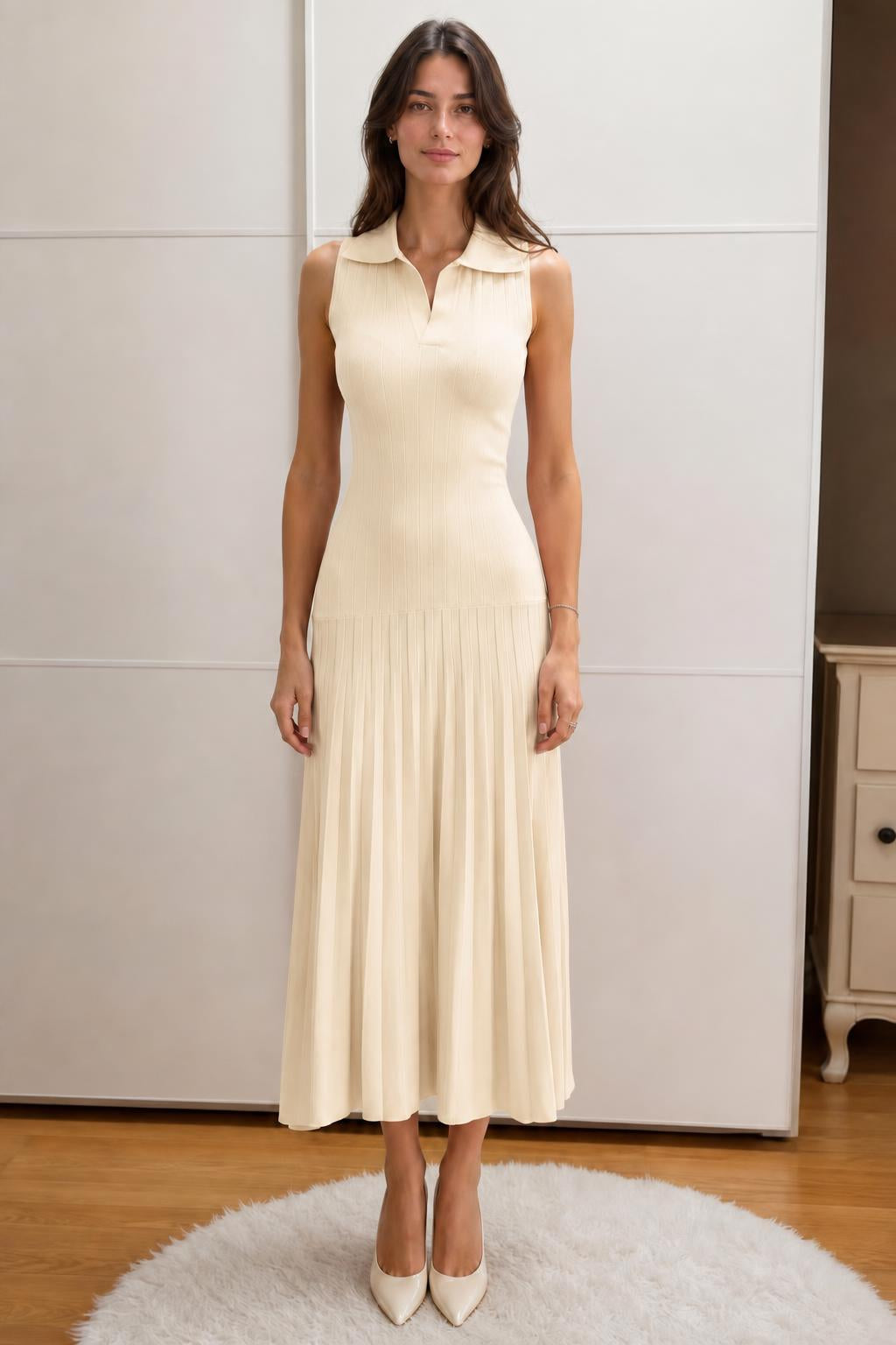 Front view of woman wearing beige sleeveless polo knit midi dress