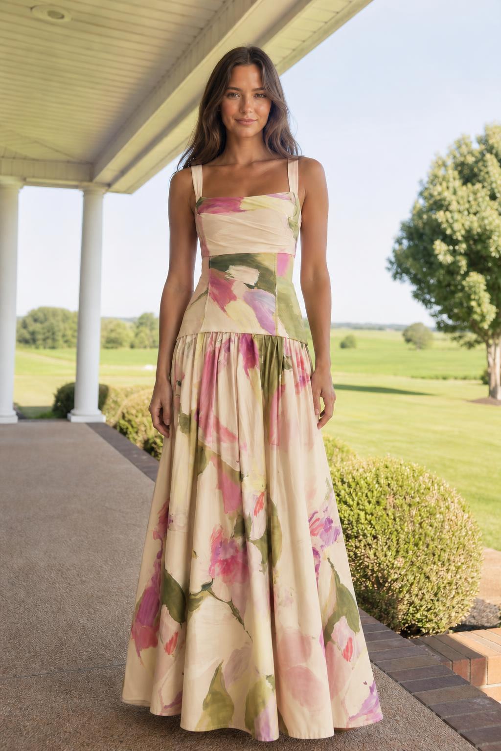 Front view of model wearing champagne floral print maxi dress