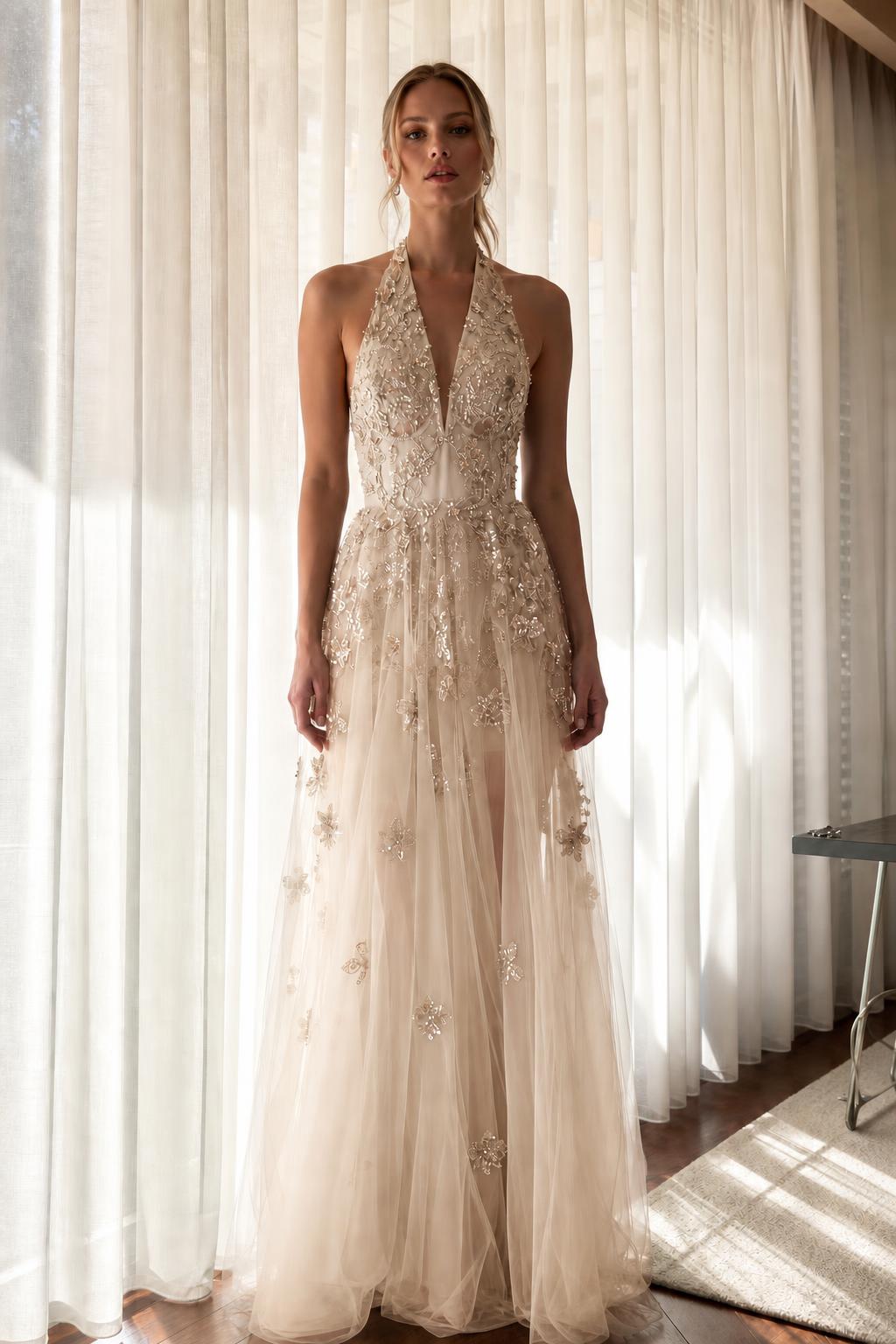 Front view of champagne embroidered halter evening dress