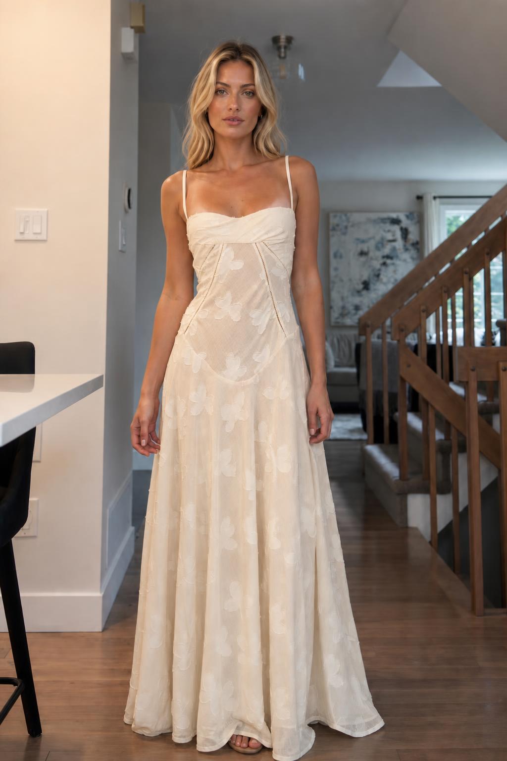 Front view of woman wearing champagne floral jacquard maxi dress