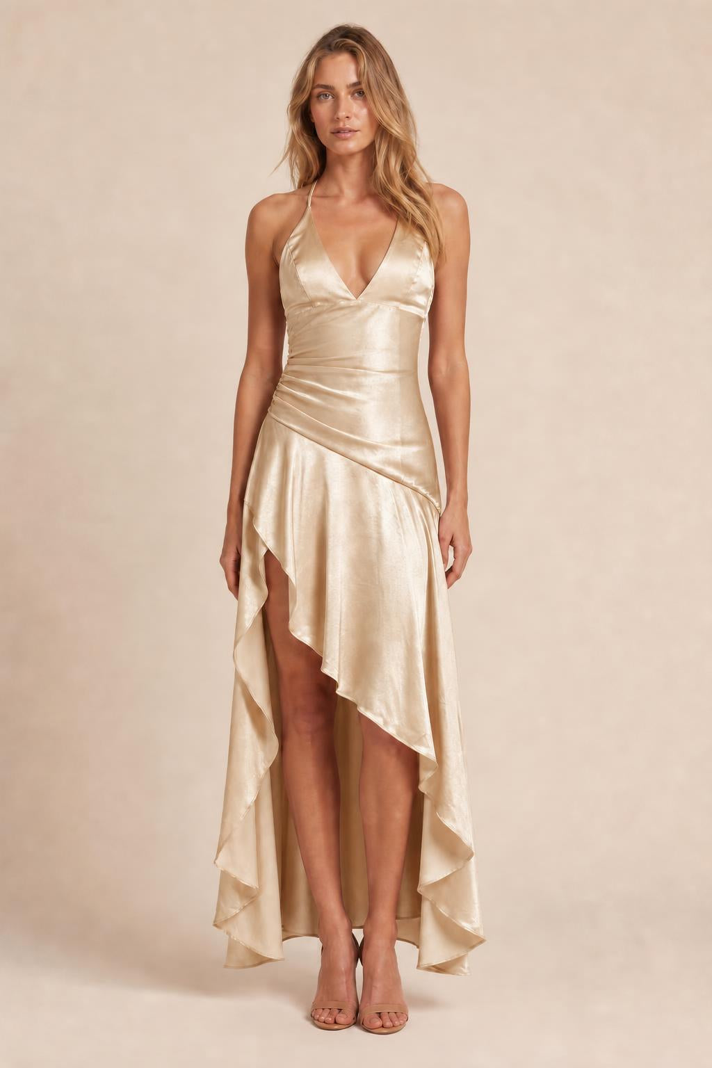Model wearing champagne satin halter high-low maxi dress