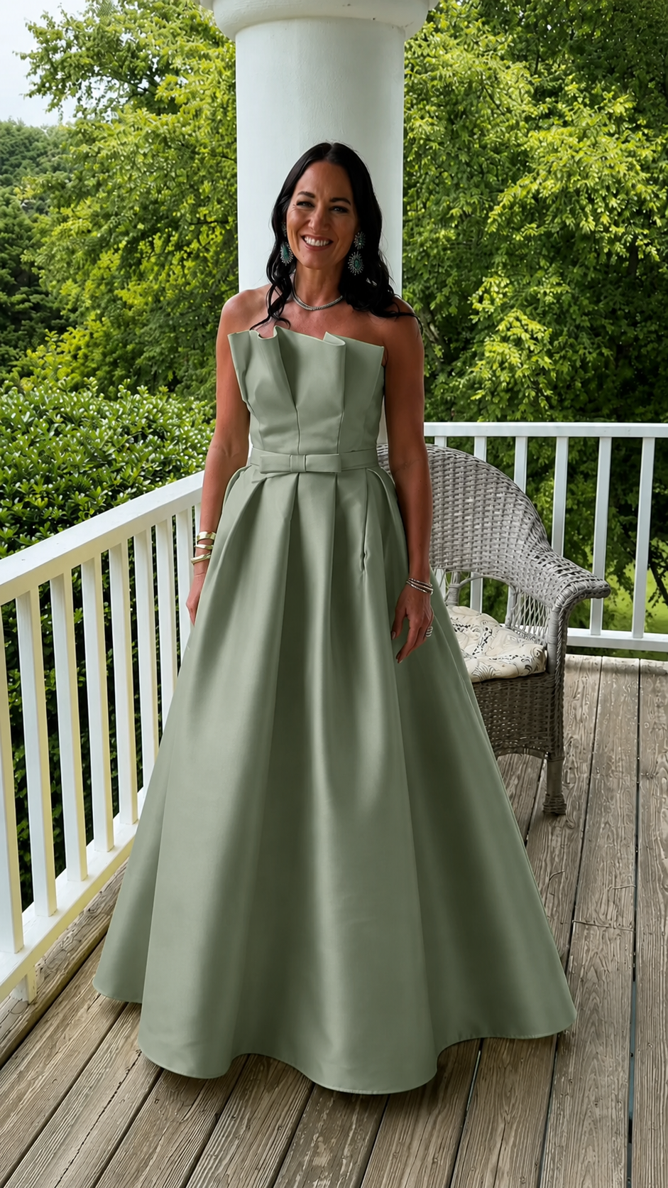 Front view of sage green strapless A-line full-length gown
